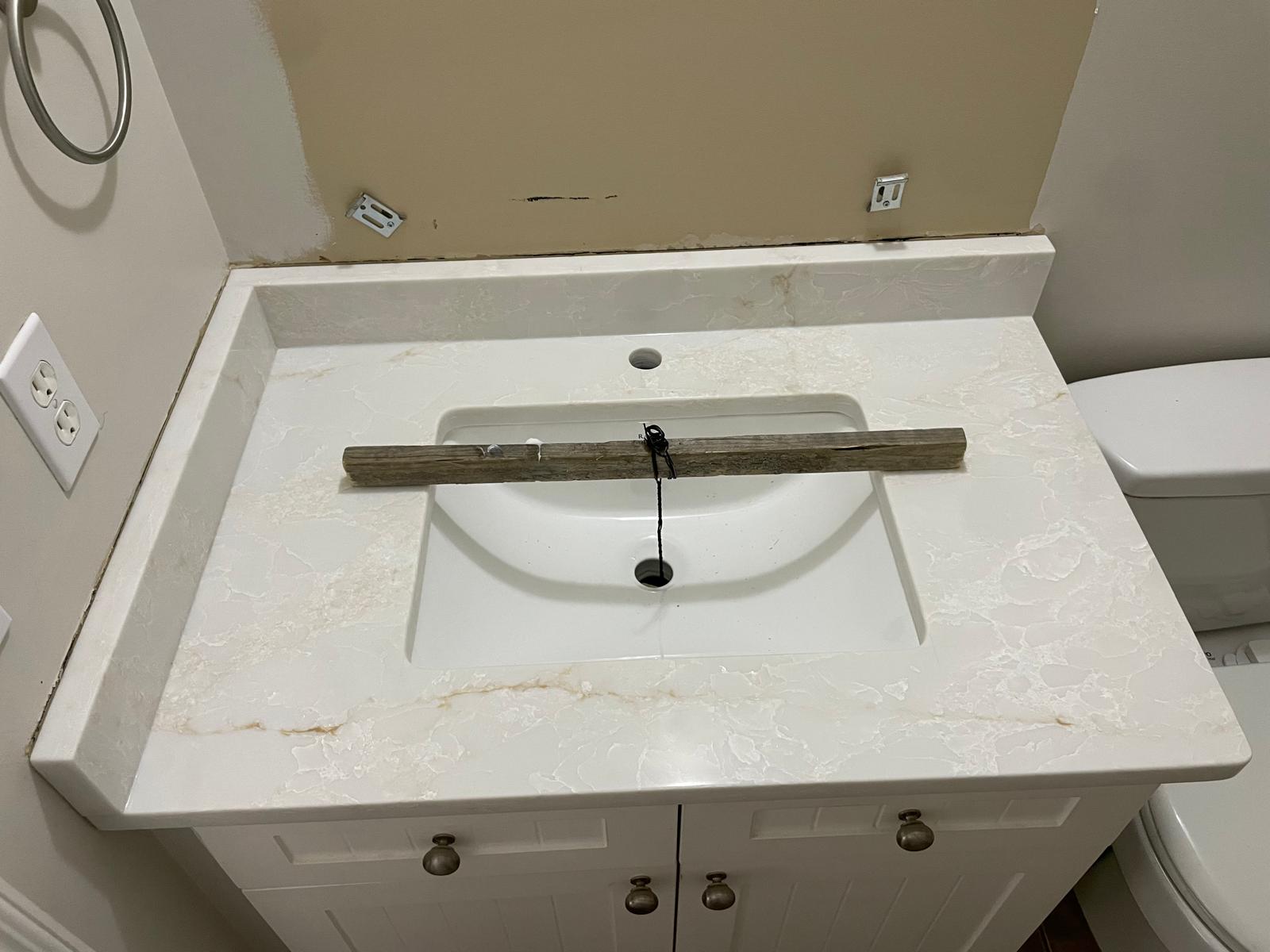 Stone bathroom vanity top with integrated undermount sink